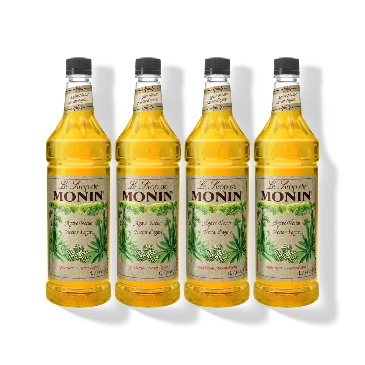 Four 1L plastic bottles of Monin Organic Agave Nectar in a row