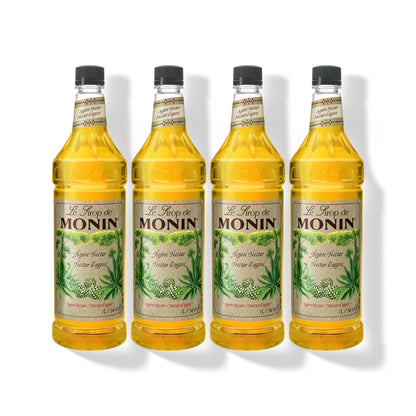 Four 1L plastic bottles of Monin Organic Agave Nectar in a row