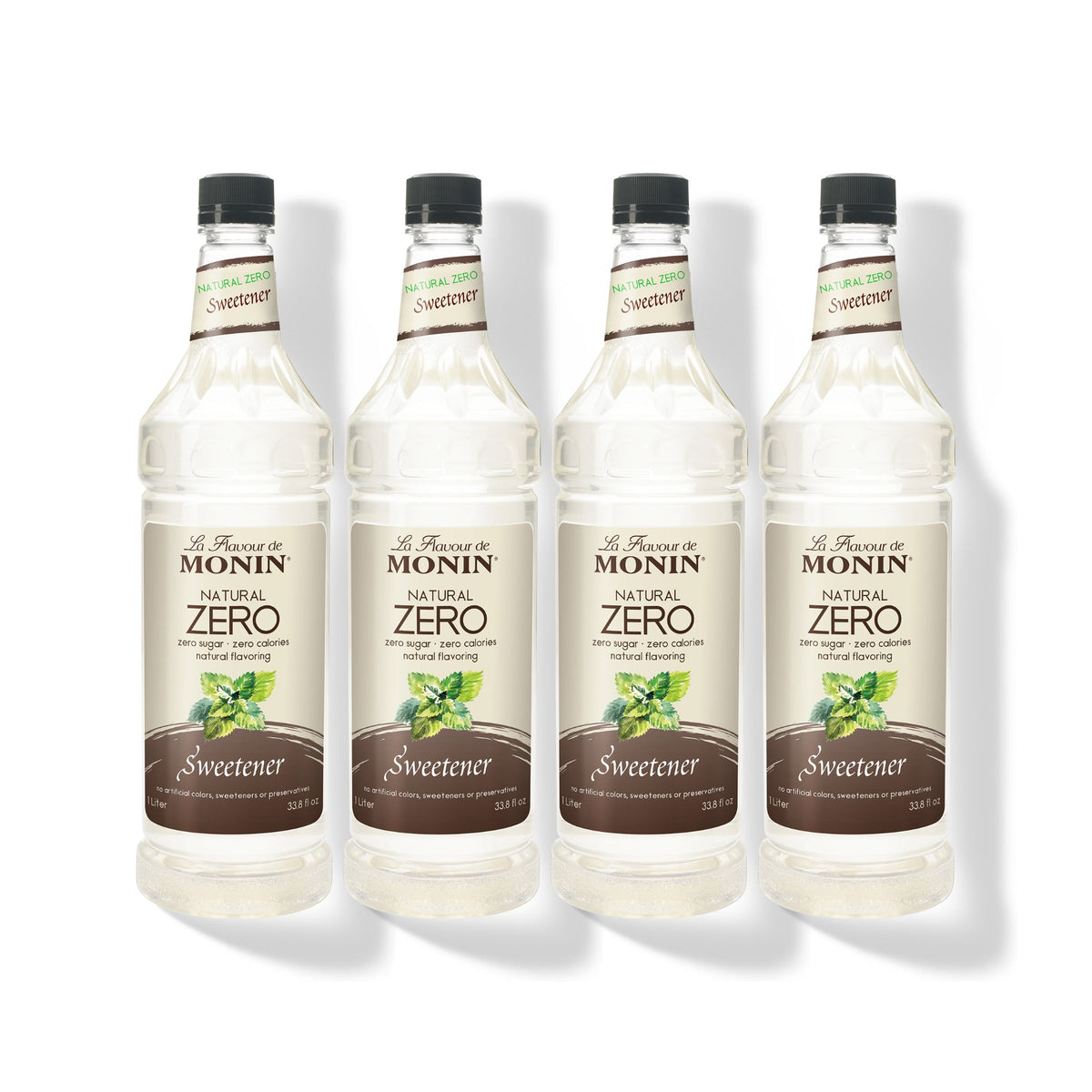 Four 1L plastic bottles of Monin Natural Zero Sweetener in a row