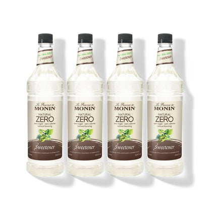 Four 1L plastic bottles of Monin Natural Zero Sweetener in a row