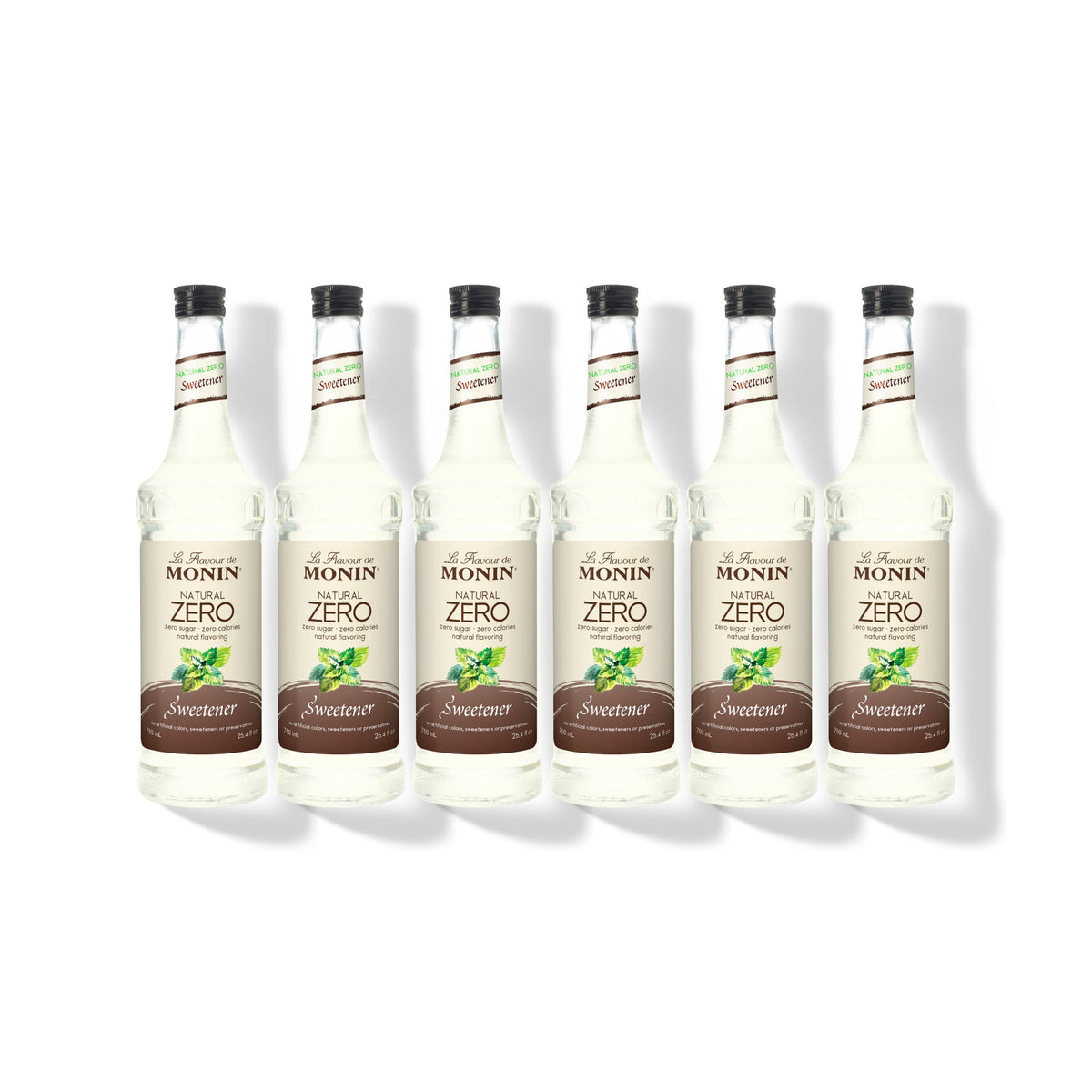 Six 750ml glass bottles of Monin Natural Zero Sweetener in a row